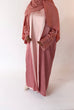 Load image into Gallery viewer, Women&#39;s reversible 2-in-1 abaya 3-piece set in pink and light pink. Includes an outer abaya, underdress, and matching hijab in a darker pink shade. Versatile modest wear, perfect for any occasion. High-quality satin fabric, elegant design, and modest fashion essentials. One set, multiple ways to style.
