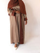 Load image into Gallery viewer, Women&#39;s reversible 2-in-1 abaya 3-piece set in brown. Includes an outer abaya, underdress, and matching hijab in a darker brown shade. Versatile modest wear, perfect for any occasion. High-quality satin fabric, elegant design, and modest fashion essentials. One set, multiple ways to style.
