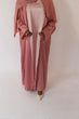 Load image into Gallery viewer, Women&#39;s reversible 2-in-1 abaya 3-piece set in pink and light pink. Includes an outer abaya, underdress, and matching hijab in a darker pink shade. Versatile modest wear, perfect for any occasion. High-quality satin fabric, elegant design, and modest fashion essentials. One set, multiple ways to style.
