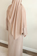 Load image into Gallery viewer, Image of a model wearing our classic taupe open abaya. The abaya can be styled open or closed, offering versatility for any occasion. It&#39;s perfect for all seasons and can be easily dressed up or down for a chic look. 
