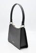 Load image into Gallery viewer, Side view of a black shoulder bag. Black evening bag with shoulder strap and gold hardware with zipper 
